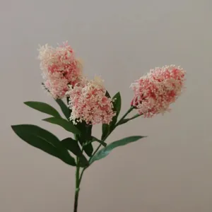 Artificial flower branch detail, 3 pink flower heads with green leaves for home decor.