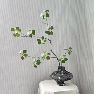 Artificial green leaf branches for home decor, realistic faux plants for floral arrangement.