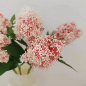 Exquisite artificial skimmia flower detail shot, pink and white floral decor for home or studio.