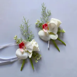 Artificial phalaenopsis orchid and rose corsage detail, perfect for wedding and photography decor.