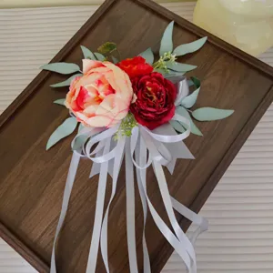 Artificial flower chair back decoration for wedding party event venue styling and photo props.