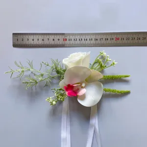 Artificial orchid flower corsage boutonniere for wedding bride bridesmaid photography.