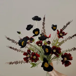 Artificial flower bouquet detail, black and dark red faux cosmos and poppy floral arrangement.