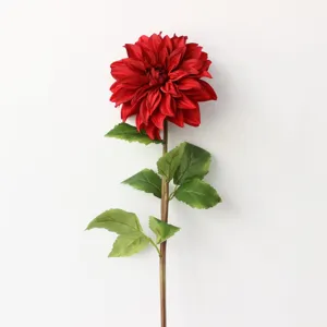 Detailed close-up of a single artificial red dahlia flower with green leaves for home decor.