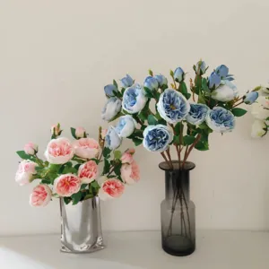 Close-up detail of artificial Austin roses bouquet in modern vases, perfect for home decor.