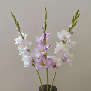 Artificial gladiolus flower stem detail view, elegant purple white gradient decor.
