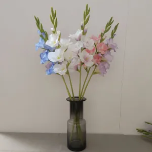 Artificial gladiolus flower detail in glass vase, elegant home decor floral arrangement for living room.