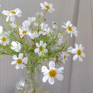 Artificial white daisy flower bouquet detail in glass vase, perfect for home decor.