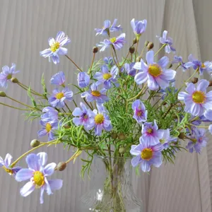 Detailed view of artificial purple cosmos flowers in glass vase, perfect for home decor and crafts.