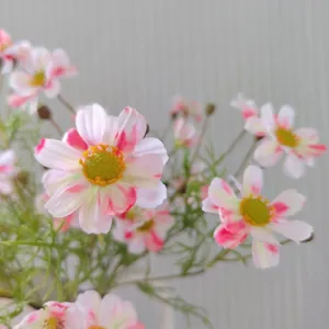 Artificial cosmos flower details, pink and white faux daisy blooms for DIY crafts and decor.