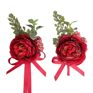 Red artificial flower boutonniere corsage for wedding groom bridesmaid party decoration.