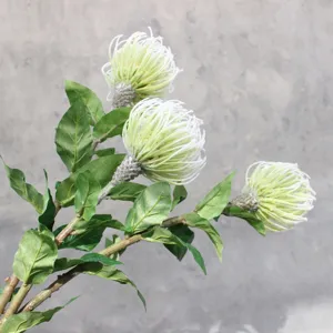Single branch artificial pincushion flower with green leaves and realistic stem details for decor.