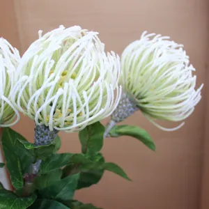 Single branch flocked pincushion artificial flower detail, realistic tropical flora decor.
