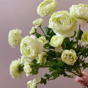 Detailed close-up view of artificial ranunculus flower, beautiful silk floral decor.