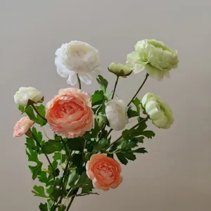 Artificial ranunculus flower detail, silk floral arrangement for home decor and photography.