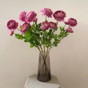 Artificial flower bouquet in glass vase purple silk floral decor for home photography