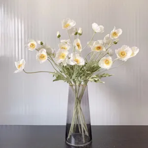 Artificial Iceland poppy silk flowers bouquet with fuzzy stems in grey glass vase for home decor.