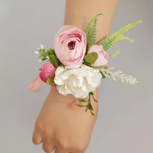 Artificial pink and white rose wrist corsage for wedding bridesmaid bridal wrist flower decor.