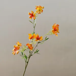 Artificial clematis flower detail, orange petals and green stem for DIY crafts and decor.