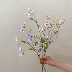 Closeup of artificial clematis small flowers branch detail, perfect for DIY crafts and floral decor.