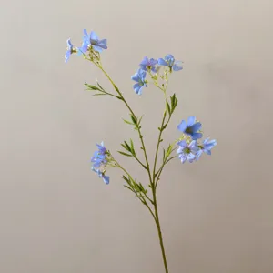 Detail shot of artificial blue flower branch, perfect for DIY crafts, home decor and props.