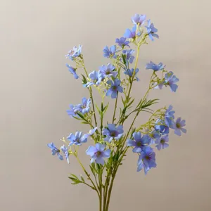 Detail view of blue artificial clematis silk flowers, perfect for DIY crafts and home decor.