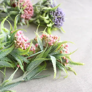 Artificial frosted fern leaf berry branch, plastic plant for home floral decor and DIY crafts.