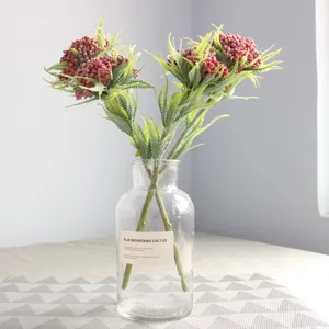 Artificial fern leaves with frosted red berries floral arrangement for home decor vase.