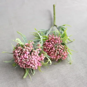 Close-up of frosted fern artificial berries and leaves, ideal for creative DIY floral decor.