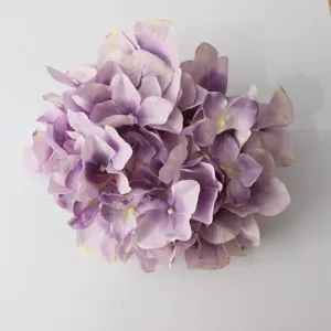 Artificial purple hydrangea flower head detail, silk floral decor for DIY crafts and home.