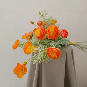 Artificial orange flower bouquet detail, silk floral arrangement for home decor photography.
