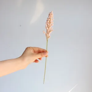 Detailed close-up of a single artificial foam millet spike flower stem for home decor setup.