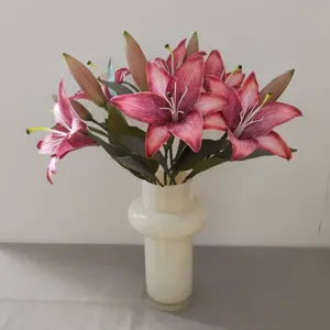 Detailed view of 3D printed retro pink artificial lily flowers in modern white ceramic vase.