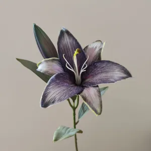 Detailed close-up of a 3D printed retro purple artificial lily flower with bud and stem.
