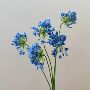 Artificial blue agapanthus flower stem for home decor floral arrangement photography props.