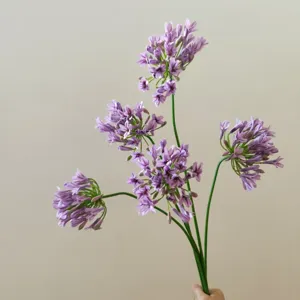 Close-up detail of artificial purple agapanthus flower stem for home decor arrangement