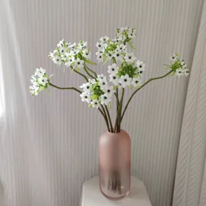 Artificial Star of Bethlehem velvet flower bouquet in pink glass vase for home decor detail.