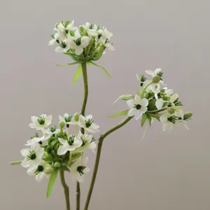 Artificial Star of Bethlehem flower detail shot, realistic white petals and green stem.