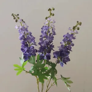 Detailed view of artificial purple delphinium flower, realistic silk floral decor for home.