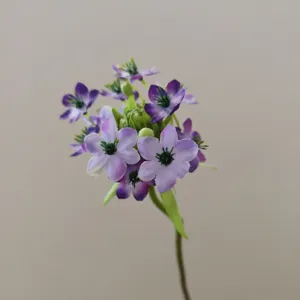 Detailed view of a purple velvet artificial flower stem, perfect for home decor display.