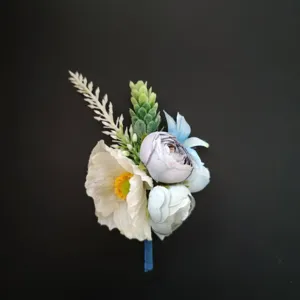 Elegant blue and white artificial boutonniere for groom wedding suit lapel flower decor.
