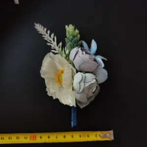 Blue artificial flower boutonniere for groom suit wedding party elegant lapel pin decoration.