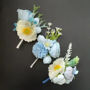 Close-up detail of blue artificial flower groom boutonniere set for wedding and business event.