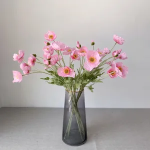 Artificial Icelandic poppy flower bouquet detail shot, coral pink velvet fake floral decor for home.