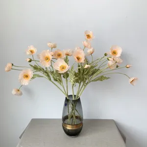 Artificial Icelandic poppy silk flower in coral pink, detailed view of textured faux floral arrangement.