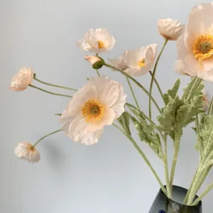 Detailed view of artificial Icelandic poppy flower bunch, coral pink, soft flocking texture.