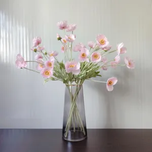 Artificial pink poppy flower bouquet detail shot, soft flocked artificial floral decor.