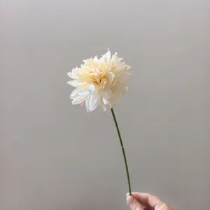 Close up detail view of artificial dahlia flower stem with retro edge burned petal design.