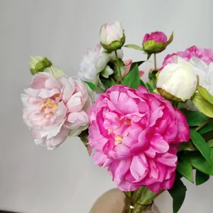 Close-up artificial silk peony flowers bouquet, detailed pink and white petals for home decor.