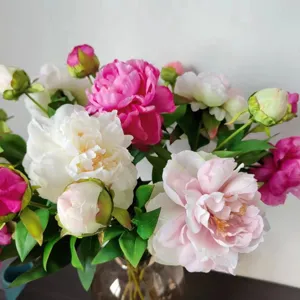 Artificial peony silk flowers detail shot, multi-color bouquet for home decor and parties.